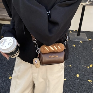 Funny baguette shaped crossbody bag for kids with plush bread trim and cookie charm
