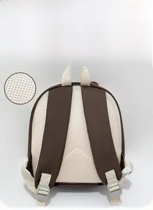 Detailed view of the breathable honeycomb mesh back and adjustable straps on child backpack