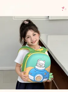 Detail view of a green kids backpack with a cute submarine bear print on a young girl
