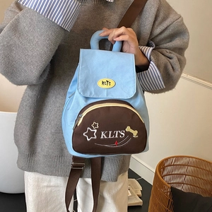 Cartoon star kids backpack with sky blue and brown patchwork design for preschool
