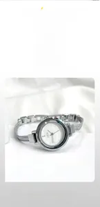 Detailed macro view of the GEDI silver bracelet watch with a minimalist white dial and chain