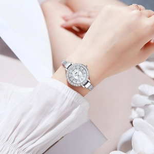 Elegant silver tassel bracelet watch for women with sparkling crystal bezel on white dial