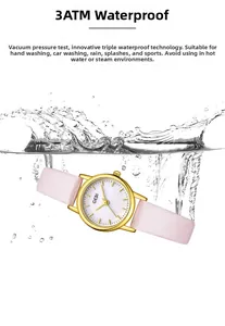 Detailed view of 3ATM waterproof gold quartz watch with pink leather strap in splashing water