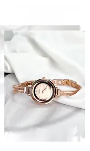 Detailed macro view of the GEDI rose gold bracelet watch on white silk background
