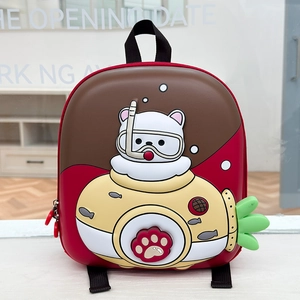 Detail of red EVA shell backpack featuring cute diving bear and submarine 3D patches