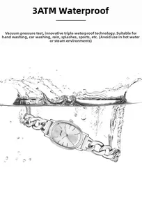 Close-up of silver-tone oval watch submerged in water demonstrating 3ATM waterproof feature