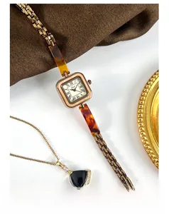 Detailed top view of a vintage Gedi square watch with rose gold case and tortoiseshell band