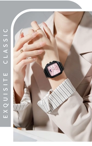 Close-up of square pink dial watch with calendar and moon phase on a female wrist