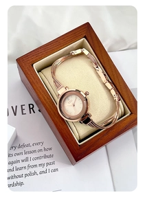 Macro view of GEDI rose gold bracelet watch placed in a premium wooden jewelry box