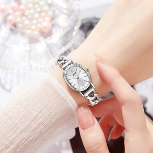 Elegant silver oval watch for women with chain bracelet and sunray dial