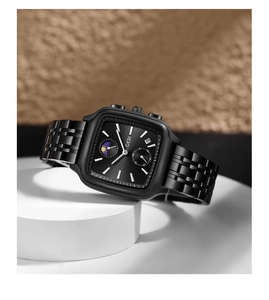 Macro shot of GEDI square black business watch with moon phase and date display window