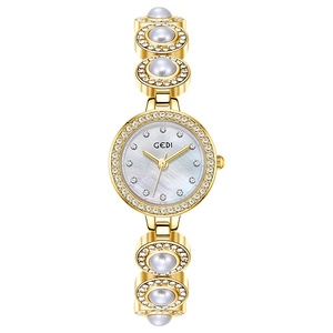 Montre GEDI dorée élégante avec bracelet en perles et lunette sertie de cristaux
