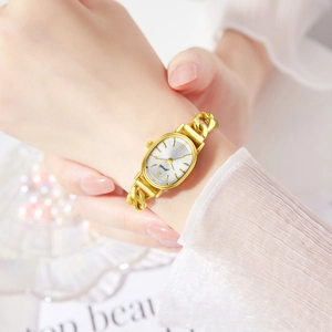 Elegant gold oval watch with brush-textured dial and vintage chain bracelet for women