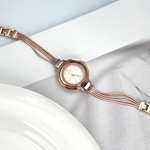 Elegant rose gold bracelet watch for women with multi-chain strap and sleek round dial