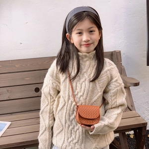 Brown quilted crossbody bag for kids featuring woven texture and minimalist flap design