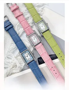 Detailed view of square quartz watches with colorful crocodile texture leather straps