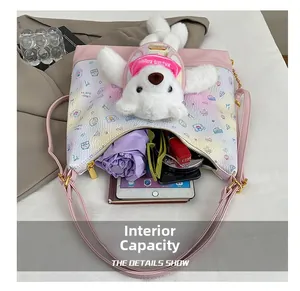 Interior capacity of the cartoon print crossbody bag showing space for tablet and umbrella