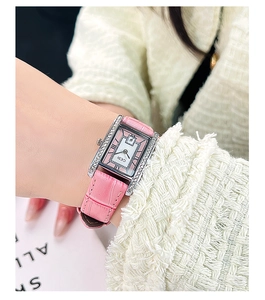 Detail of GEDI rectangular silver watch with pink croc-leather strap on female wrist