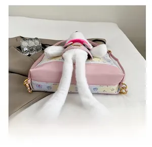 Detail shot of the durable pink leather bottom of this cute plush bear crossbody bag