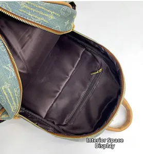 Detailed interior of teddy bear backpack showing spacious main pocket and gold zipper