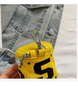 Detail of yellow mini coin purse with number 5 print and silver metal swivel hook