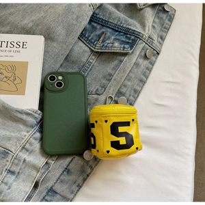 Mini yellow coin purse with black digit 5 and heart charm on denim jacket background