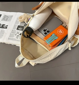 Top view of dog-shaped backpack interior with large capacity for laptop and water bottle