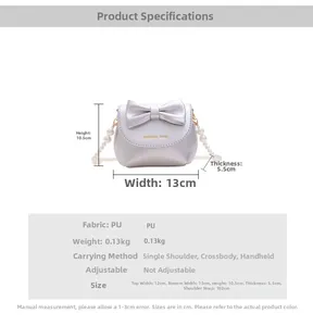 Detailed size chart for mini silver PU handbag featuring pearl handle and bow accent