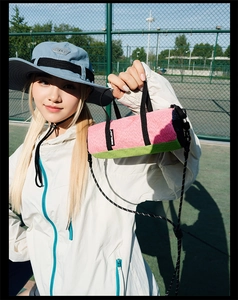 Mini cylindrical running crossbody bag in pink and green colorblock for outdoor sports