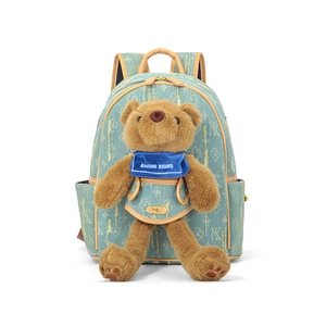 Light blue denim backpack with gold logo print and cute brown teddy bear plush charm