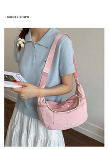 Close-up of pink Guava tote bag with contrast green trim and adjustable shoulder strap