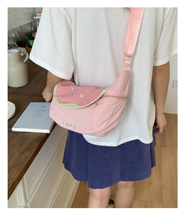 Fashionable pink watermelon tote bag with Guava embroidery on casual model outfit