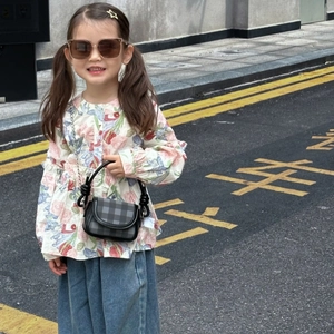 Toddler girl plaid crossbody bag with chain strap shown with a stylish floral outfit