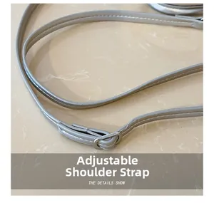 Close-up of adjustable silver shoulder strap with metal buckle for kids bucket bag