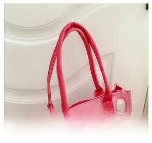 Close-up of comfortable wide handle and pink checkered canvas on cute child crossbody bag