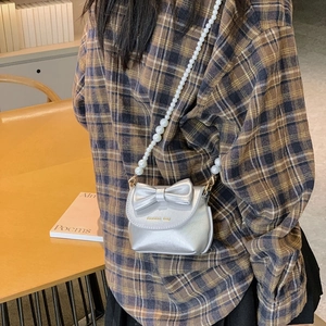 Mini silver girl's crossbody bag with bow detail and white pearl shoulder strap