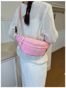 Detail view of pink bow print waist bag with durable plastic buckle and fabric strap