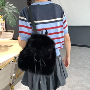 Solid black plush backpack for women with drawstring closure and fluffy faux fur texture
