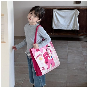 Pink canvas tote bag featuring cute cartoon rabbit print and matching mascot pendant
