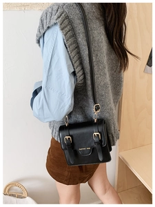 Black vintage children messenger bag with gold buckles and fashion bag lettering