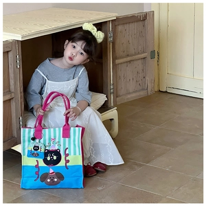 Detailed view of kids cartoon canvas tote bag with pet print and matching mini zip pouch