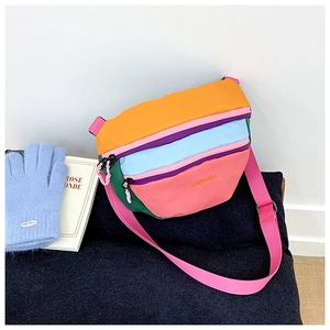 Detail of colorful patchwork crossbody bag with embroidery and adjustable strap