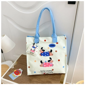 Detail of cute canvas tote bag featuring smile puppy print and matching mini pouch