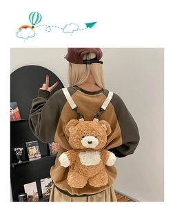 Detail of cute brown plush bear backpack showing soft texture and adjustable straps