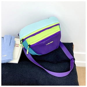 Detail of color-block kids crossbody bag with blue and green nylon and adjustable strap