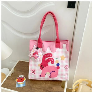 Detail of pink plaid canvas tote bag with cartoon rabbit print and matching mini pouch