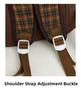 Detail of adjustable shoulder strap buckle on brown plaid children backpack
