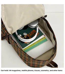 Top view of kids plaid backpack interior showing spacious storage for A4 magazines and items