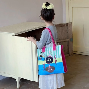 Colorful striped kids tote bag with cute cat and dog patterns and pink shoulder strap