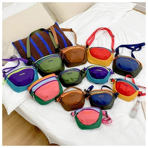 Detailed view of colorful nylon crossbody bags with adjustable straps and zipper closures